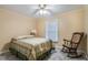 Guest bedroom with rocking chair and window seat at 8045 Happy Trl, Kissimmee, FL 34747