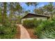 Back exterior of the house with a brick pathway at 8045 Happy Trl, Kissimmee, FL 34747