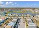 Bird's-eye view of houses, lake, and community at 8153 Surf St, Kissimmee, FL 34747