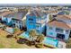 Aerial view of a community with colorful houses and private pools at 8153 Surf St, Kissimmee, FL 34747