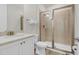 Bathroom with shower, toilet and white vanity at 8153 Surf St, Kissimmee, FL 34747