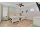 Guest bedroom with twin beds, plenty of natural light, and hardwood floors at 8153 Surf St, Kissimmee, FL 34747