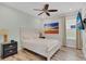 Comfortable bedroom with TV and plenty of natural light at 8153 Surf St, Kissimmee, FL 34747