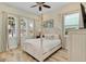 Charming bedroom with a white poster bed and plenty of natural light at 8153 Surf St, Kissimmee, FL 34747