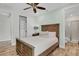 Bedroom with a queen-size bed, dresser, and ceiling fan at 8153 Surf St, Kissimmee, FL 34747