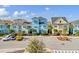 Row of colorful houses with tile roofs and palm trees at 8153 Surf St, Kissimmee, FL 34747