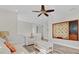 Living room with white sofa, coffee table, and Scrabble board at 8153 Surf St, Kissimmee, FL 34747