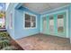 Private patio with brick flooring and double doors at 8153 Surf St, Kissimmee, FL 34747