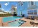 Inviting pool and spa with patio furniture and grill at 8153 Surf St, Kissimmee, FL 34747