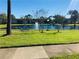 Community lake with lush green landscaping at 8211 Sun Spring Cir # 42, Orlando, FL 32825