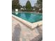 Community swimming pool with a spacious deck at 8211 Sun Spring Cir # 42, Orlando, FL 32825