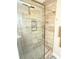 Updated shower with glass enclosure and neutral tile at 8407 Riverdale Ln, Davenport, FL 33896