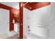 Simple bathroom with shower/tub and red walls at 8511 La Isla Dr, Kissimmee, FL 34747