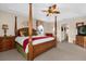 Main bedroom with a king-size bed, and ensuite bathroom access at 8511 La Isla Dr, Kissimmee, FL 34747