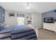 Spacious bedroom with a white dresser and striped bedding at 8511 La Isla Dr, Kissimmee, FL 34747