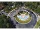 Aerial view of community entrance with fountain and landscaping at 8511 La Isla Dr, Kissimmee, FL 34747