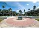 Resort entrance with fountain and landscaping at 8511 La Isla Dr, Kissimmee, FL 34747