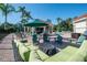 Relaxing patio area with fire pit and seating near the pool at 8511 La Isla Dr, Kissimmee, FL 34747