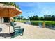 Tranquil sandy beach area with lake view and lounge chairs at 8511 La Isla Dr, Kissimmee, FL 34747