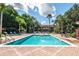 Relaxing resort pool with lounge chairs at 8511 La Isla Dr, Kissimmee, FL 34747