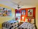 Mickey Mouse themed bedroom with two twin beds at 8515 Sunrise Key Dr, Kissimmee, FL 34747