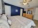 King-size bed, dresser and ceiling fan in main bedroom at 8515 Sunrise Key Dr, Kissimmee, FL 34747