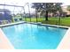 Inviting screened pool with lounge chairs at 8515 Sunrise Key Dr, Kissimmee, FL 34747