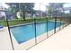 Refreshing pool with safety fence at 8515 Sunrise Key Dr, Kissimmee, FL 34747