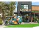 Chroma Modern Bar + Kitchen exterior with a colorful Park Brewing tuk-tuk at 9121 Laureate Blvd, Orlando, FL 32827