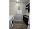 Spacious laundry room, featuring washer, dryer, and built-in shelving at 9121 Laureate Blvd, Orlando, FL 32827