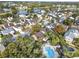 Aerial view of a house and community pool near a lake at 942 Beresford Way, Lake Mary, FL 32746