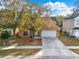 Two-story house with driveway, landscaping, and a tan exterior at 942 Beresford Way, Lake Mary, FL 32746