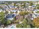 Aerial view of houses near a community pool and lake at 942 Beresford Way, Lake Mary, FL 32746