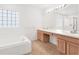 Spacious bathroom with a double vanity and a separate shower at 942 Beresford Way, Lake Mary, FL 32746