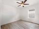 Spacious bedroom featuring a ceiling fan and wood-look floors at 942 Beresford Way, Lake Mary, FL 32746