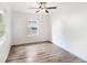 Bright bedroom with ceiling fan and wood-look floors at 942 Beresford Way, Lake Mary, FL 32746