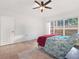 Relaxing bedroom with a large window and tile flooring at 942 Beresford Way, Lake Mary, FL 32746