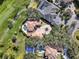 Luxury estate home situated on a golf course with a circular driveway at 9512 Tavistock Rd, Orlando, FL 32827