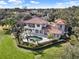 Luxury home with pool and lush landscaping, offering expansive views at 9512 Tavistock Rd, Orlando, FL 32827