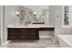 Bathroom features floating vanity with marble countertop at 9512 Tavistock Rd, Orlando, FL 32827