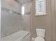 Bathroom with shower/tub combo and updated fixtures at 9512 Tavistock Rd, Orlando, FL 32827