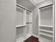 Large walk-in closet with double hanging rods and shelves at 9512 Tavistock Rd, Orlando, FL 32827