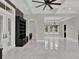 Spacious living room with built-in shelving and hardwood floors at 9512 Tavistock Rd, Orlando, FL 32827