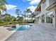 Luxury pool and spa with a view of the home at 9512 Tavistock Rd, Orlando, FL 32827