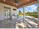 Spacious patio with outdoor kitchen and pool view at 9512 Tavistock Rd, Orlando, FL 32827