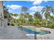 Resort-style pool and spa with lush landscaping at 9512 Tavistock Rd, Orlando, FL 32827