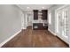 Basement wet bar with dark cabinetry and granite countertop at 9512 Tavistock Rd, Orlando, FL 32827