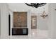 Custom wet bar with stone feature wall, wine fridge and beverage center at 9512 Tavistock Rd, Orlando, FL 32827