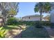 Landscaped backyard with stone pathways and lush greenery at 960 Manchester Ave, Oviedo, FL 32765