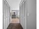 View down hallway to the Primary bathroom with double vanities and tub at 960 Manchester Ave, Oviedo, FL 32765